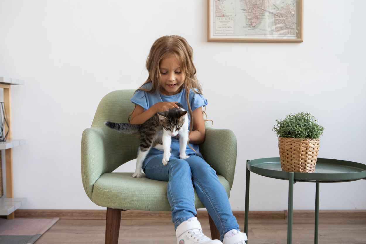 child holding a cat